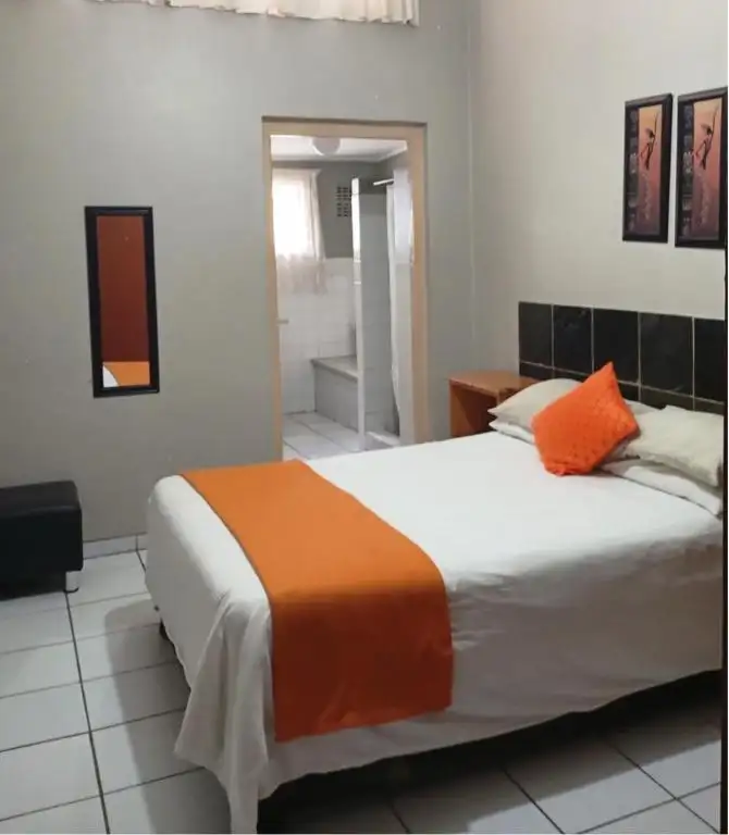 Double room with orange runner