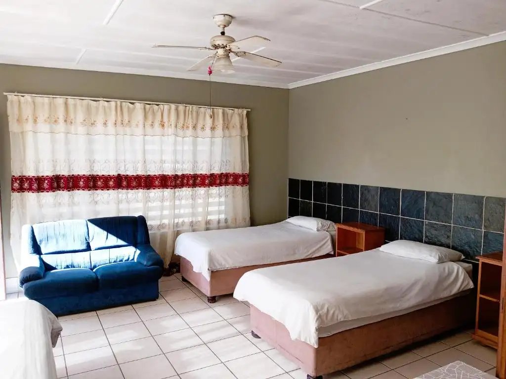 Family style room with twin beds and seating